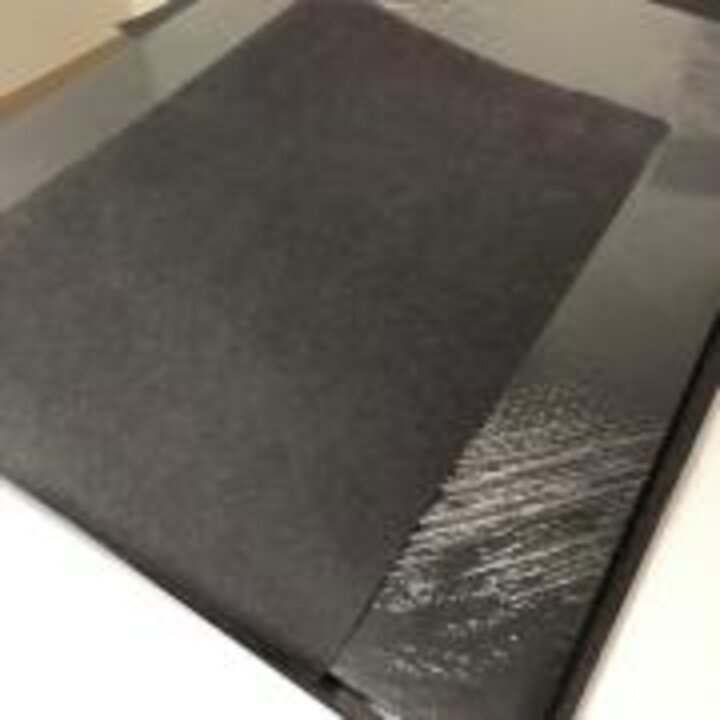Photo of black construction paper covering scanner bed.