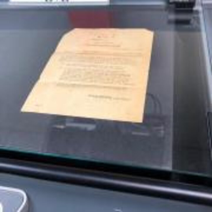 Photo of glass lowered over the item.