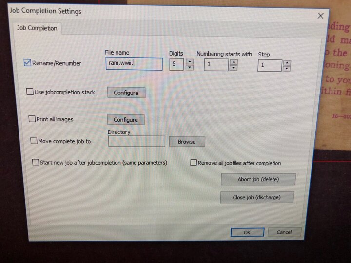Photo showing screen with "Job Completion Settings" dialogue box.